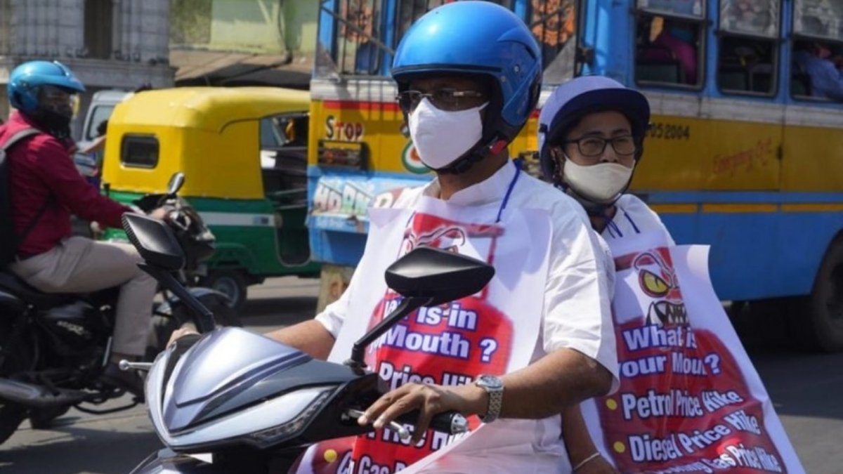 Mamata Banerjee rides an electric scooter to protest the fuel price hike - India Press Release