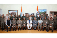 Raksha Mantri interacts with global women peacekeepers taking part in UN Women Military Officers Course 2025 in New Delhi